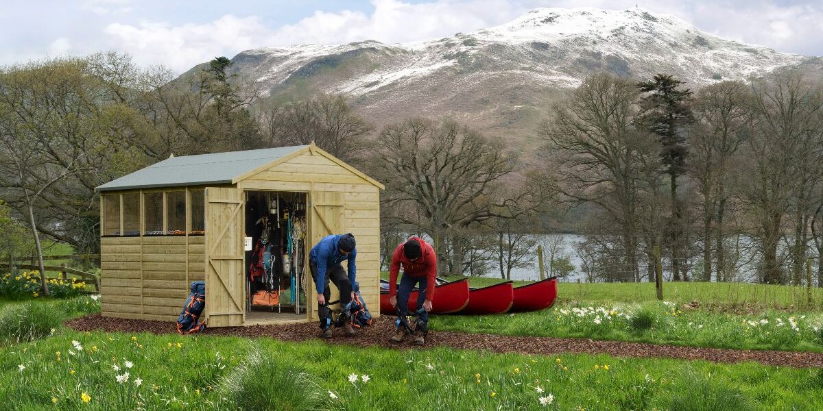 A group of people working in a shed Description automatically generated