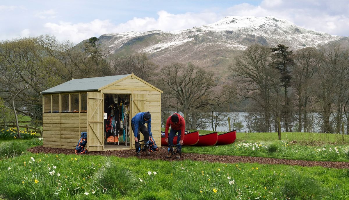A group of people working in a shed Description automatically generated