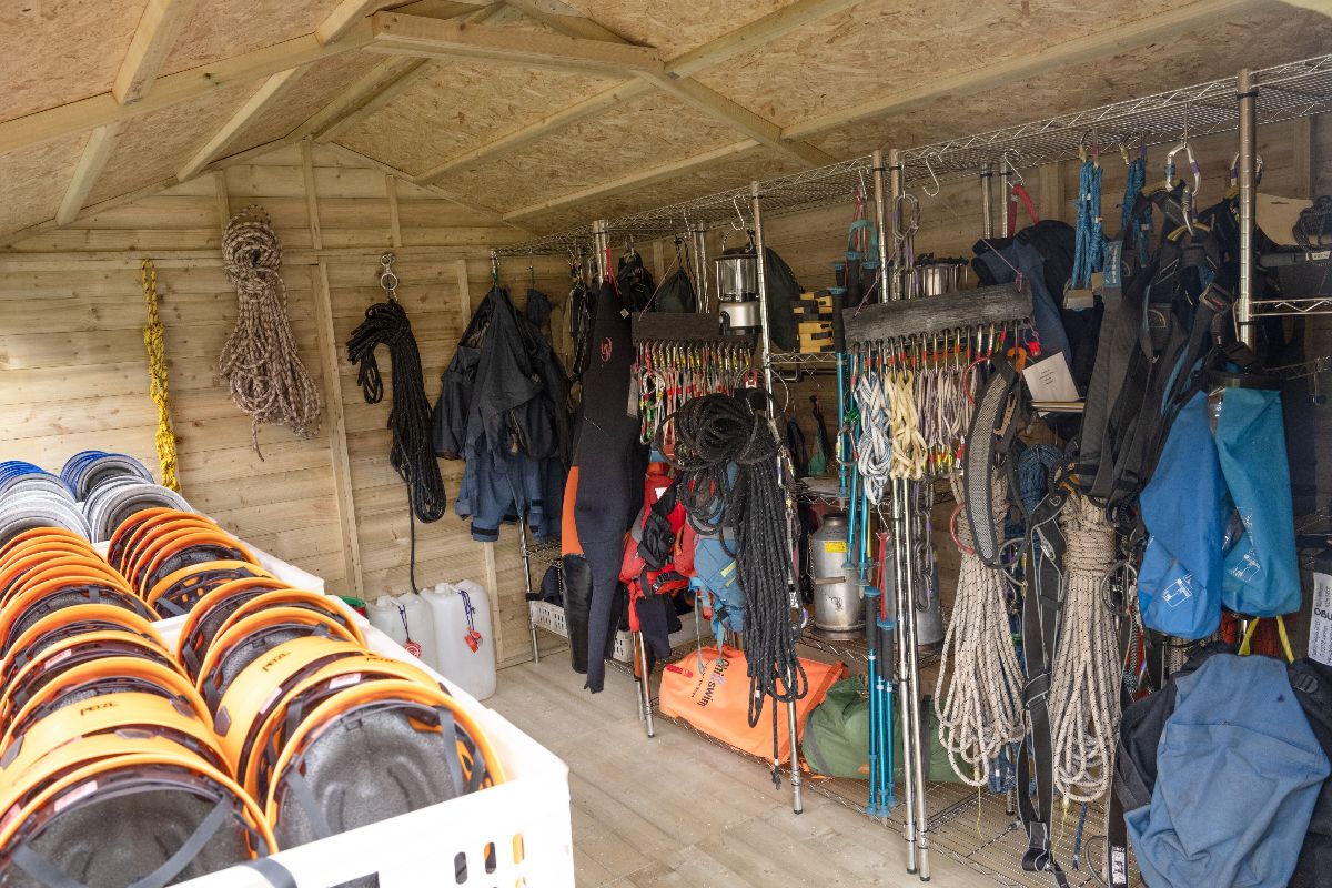 A room with ropes and ropes from hooks Description automatically generated