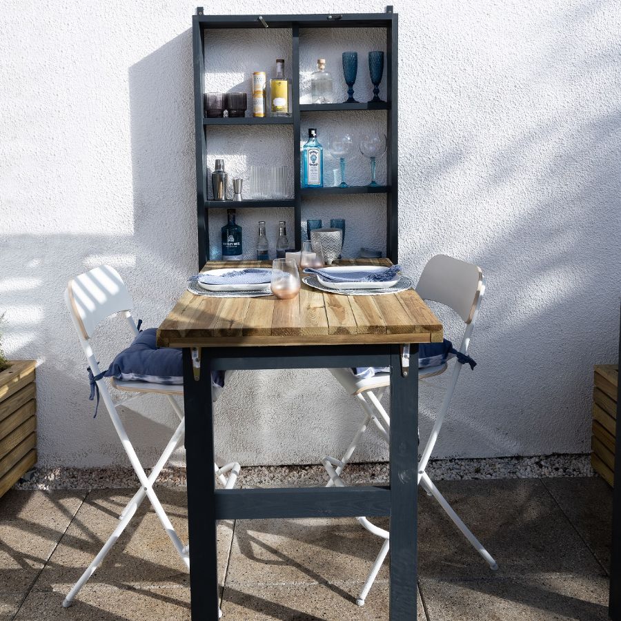 A table and chairs on a patio Description automatically generated