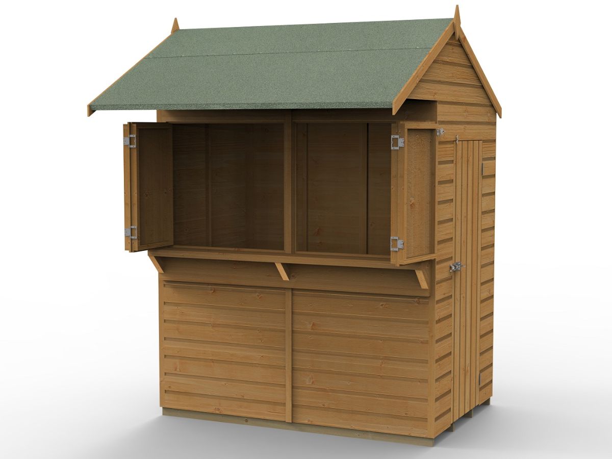 A wooden shed with a green roof Description automatically generated