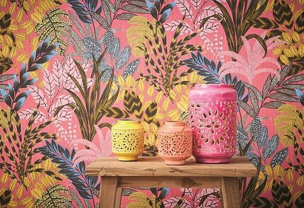 brightly coloured tropical wallpaper ina room setting