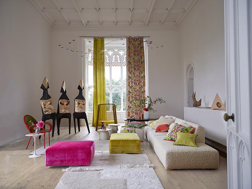 A roomset image showing ghirlanda fabric being used on curtains and cushions