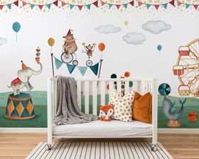 A baby's room with a colorful circus-themed wall mural, creating a playful and vibrant atmosphere.
