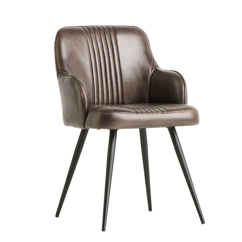 A stylish leather dining chair with vertical stitching detail on the backrest. The chair has a curved, comfortable design with a well-padded seat and supportive back. It stands on four slender, angled black metal legs, giving it a modern and sleek appearance suitable for a contemporary dining setting