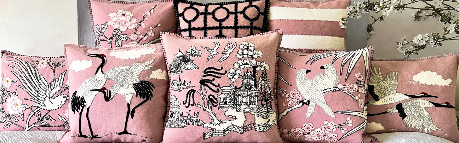 A bed piled high with pillows