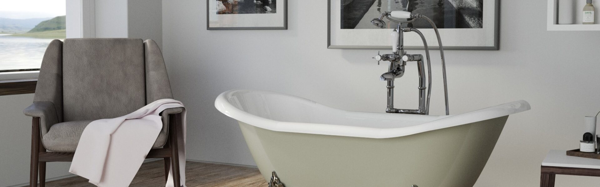 A white clawfoot bathtub with rolled edges sits in a bathroom with patterned tile floors. A wooden chair with a towel draped over it sits beside the bathtub.
