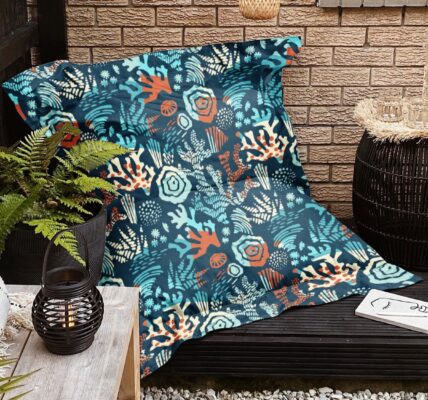 A photo of a patio with a bean bag chair and pillows on the ground.