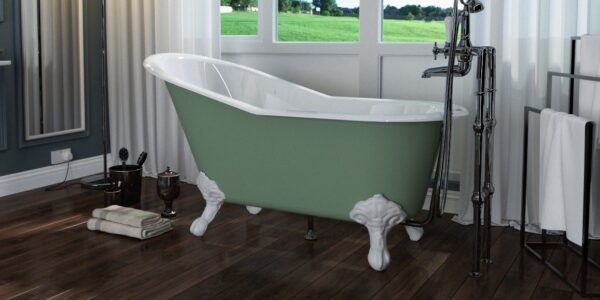 A green and white claw-foot bathtub with rolled ends sits on a light-coloured wooden floor in a bathroom. The bathtub has nickel-plated claw feet and a drainpipe. There is a white towel rack with two white towels on the wall behind the bathtub. In the corner of the image, there is a small wicker basket filled with rolled-up white towels.