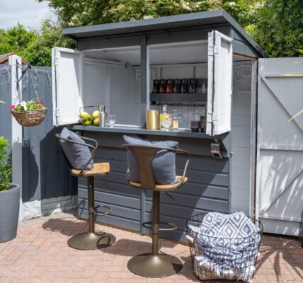 Image of a colourful outdoor bar which has been painted in a classic grey shade