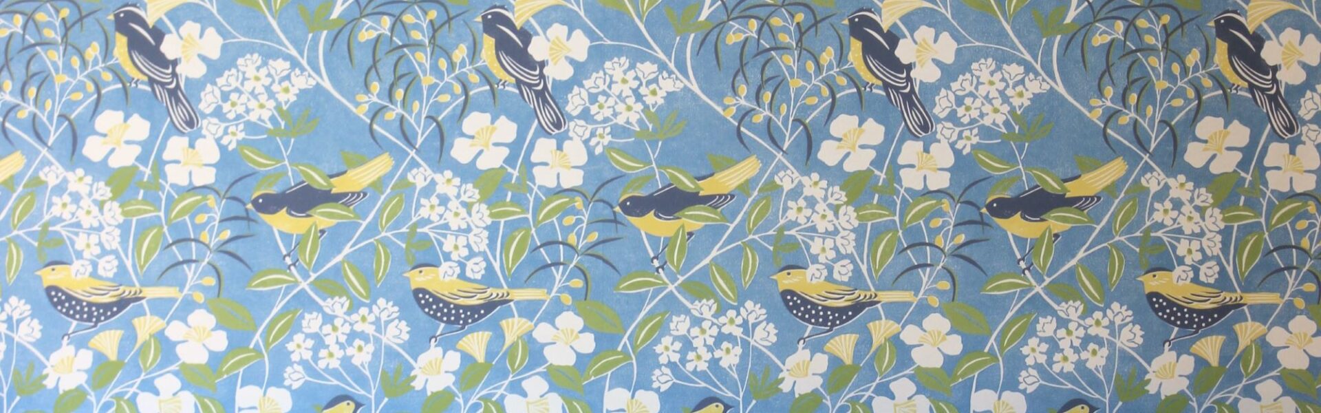 A blue wallpaper with a subtle, organic pattern reminiscent of birdsong waves.