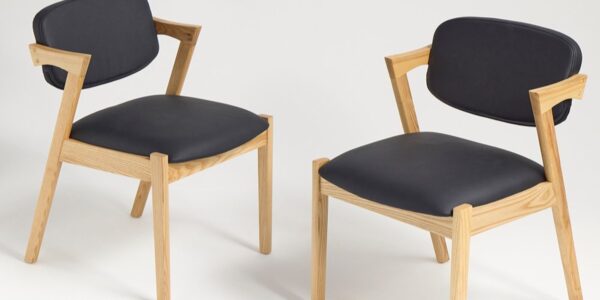 Two modern dining chairs with a clean and minimalist design