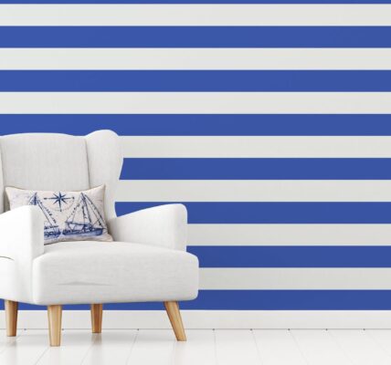 A living room wall with bold blue and white striped wallpaper