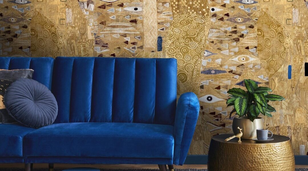 The wallpaper features a large-scale abstract design with golds, browns, and blues. There are hints of faces and eyes within the pattern, giving it a surreal and intriguing quality.