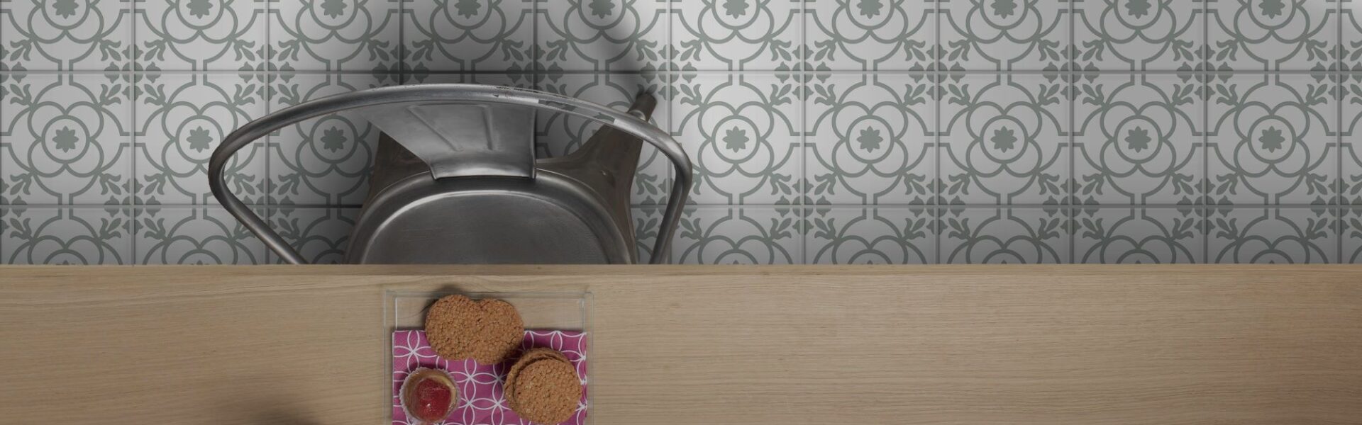 The floor is covered in a white and grey patterned tile. The pattern consists of repeating four-leaf clover shapes with a circular design in the centre. The pattern creates a sense of symmetry and elegance.