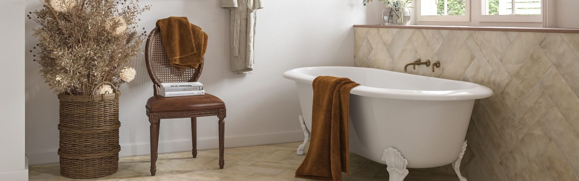Create a serene oasis with our freestanding bathtub, complete with a vintage-inspired chair, plush towels, and a decorative arrangement. The herringbone tile backsplash adds a touch of elegance, while the neutral colour palette creates a calming atmosphere