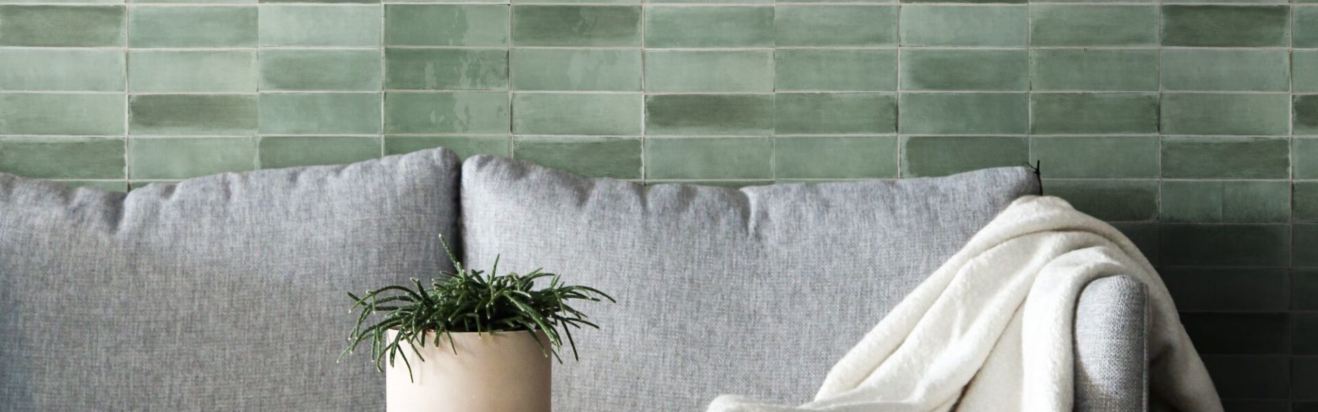 A beautiful green tile backsplash creates a calming and inviting atmosphere in this living room