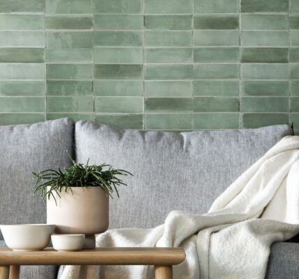 A beautiful green tile backsplash creates a calming and inviting atmosphere in this living room