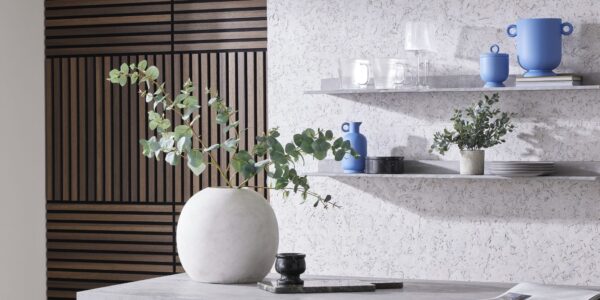 The image showcases a modern and stylish interior design with a focus on texture and natural elements. It evokes a sense of calm and sophistication with its use of neutral colours and organic materials.