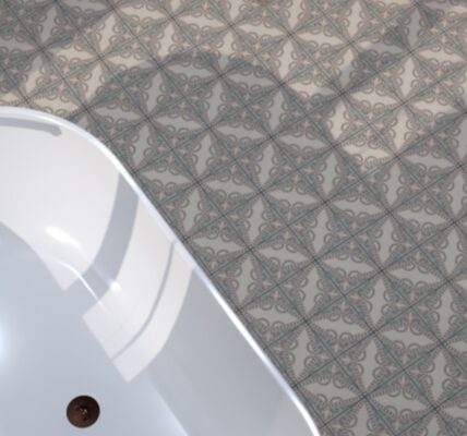 Detailed view of grey and white patterned floor tiles in a bathroom, with a portion of a white bathtub visible.