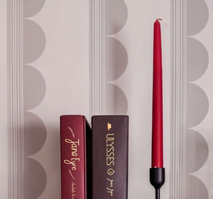 A patterned wallpaper with vertical lines and a subtle design of overlapping circles.