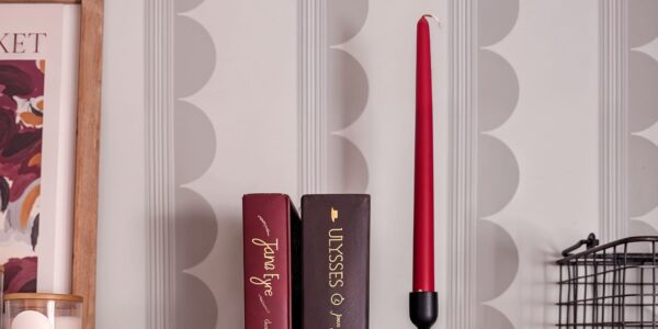 A patterned wallpaper with vertical lines and a subtle design of overlapping circles.