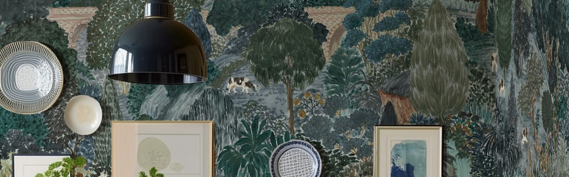 A beautifully decorated room featuring a wall adorned with a whimsical, illustrative wallpaper depicting a pastoral scene. The wallpaper, in shades of blue, green, and brown, shows rolling hills, trees, a bridge, and various animals like horses, sheep, and a cow.