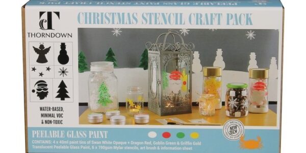 The box displays a wintery scene with a snowy background and various glass jars and lanterns decorated with the provided stencils and paints. The painted items include Santa, a Christmas tree, stars, and snowflakes. A small, unbranded tin of paint is also visible.