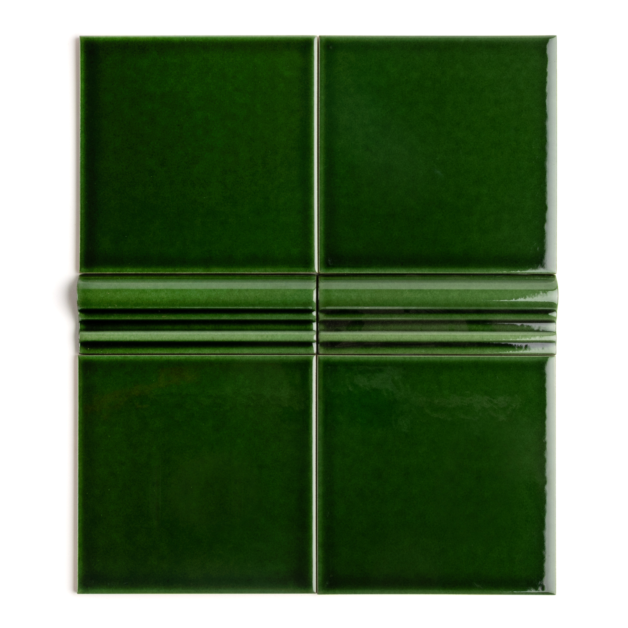 A rich, dark, emerald green tile with a high-gloss finish and dado detailing