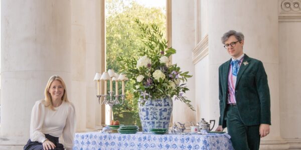 two people standing at a table