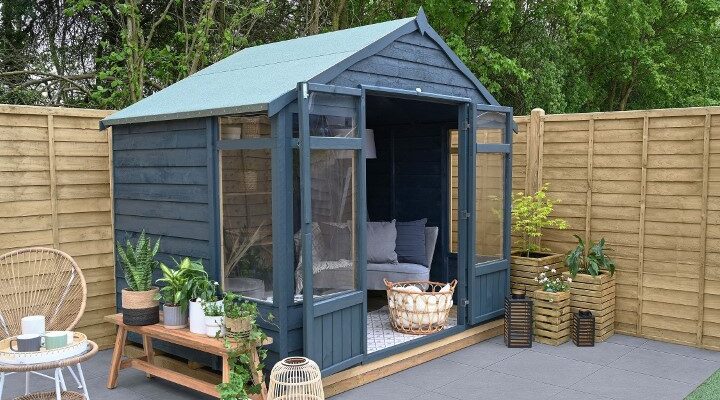 Thorndown Cavepool Grey colour on a wooden summerhouse in a garden