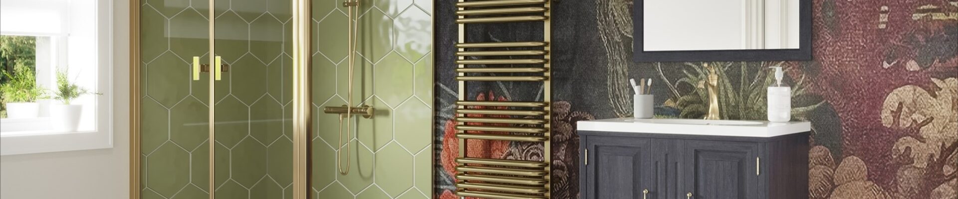 The image features a stylish bathroom with a contemporary design that incorporates brass elements. The focal point is a brushed brass dual fuel towel rail, which stands out against a dark, intricately patterned wallpaper that depicts a lush forest scene with hints of wildlife and florals in deep reds and greens. The shower enclosure showcases a geometric brass frame with clear glass, complementing the towel rail and adding a touch of modern luxury. The vanity unit is a classic dark wood with brass handles, contrasting the white basin above it and the white and black diamond patterned tile floor below. The space is well-lit, and there is a white-framed mirror above the vanity that reflects the natural light coming from the window. The overall aesthetic is one of elegance and warmth, with the brass accents lending a timeless yet trendy feel to the bathroom, exemplifying how brass fixtures can add sophistication to a home.