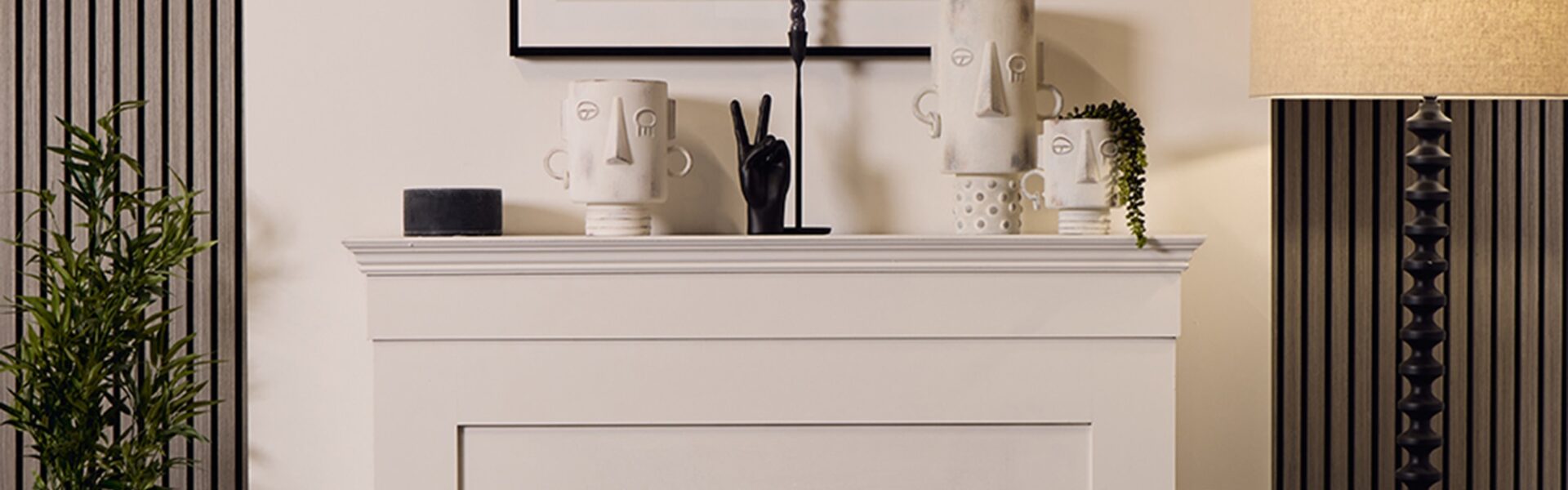 A decorative vase with a blue stone effect and black details. The design is simple and modern, with a series of black droplet-like patterns arranged in rows around the body of the vase. The neck of the vase is narrow and cylindrical, contrasting with the wider base, giving it an elegant profile that could complement a contemporary interior design.