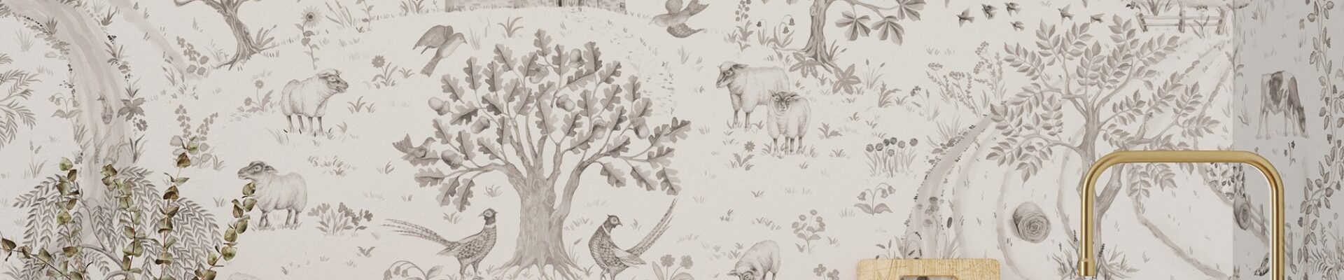 The image features a pastoral wallpaper design that seems to evoke the charm of a countryside daily walk. The sepia-toned illustrations include a variety of elements from rural life such as trees, farm animals like sheep, wild birds, and structures that could be farm fences or parts of a small rural church. The calm and detailed scenery suggests a tranquil harmony with nature. This wallpaper is used as a backdrop for what appears to be a kitchen setting, with wooden utensils and ceramic containers in the foreground, complemented by a brass faucet, enhancing the rustic aesthetic of the space. The overall effect is both nostalgic and inviting, creating a warm atmosphere.