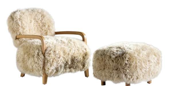 A luxurious white fur chair and footrest set against a crisp white backdrop.