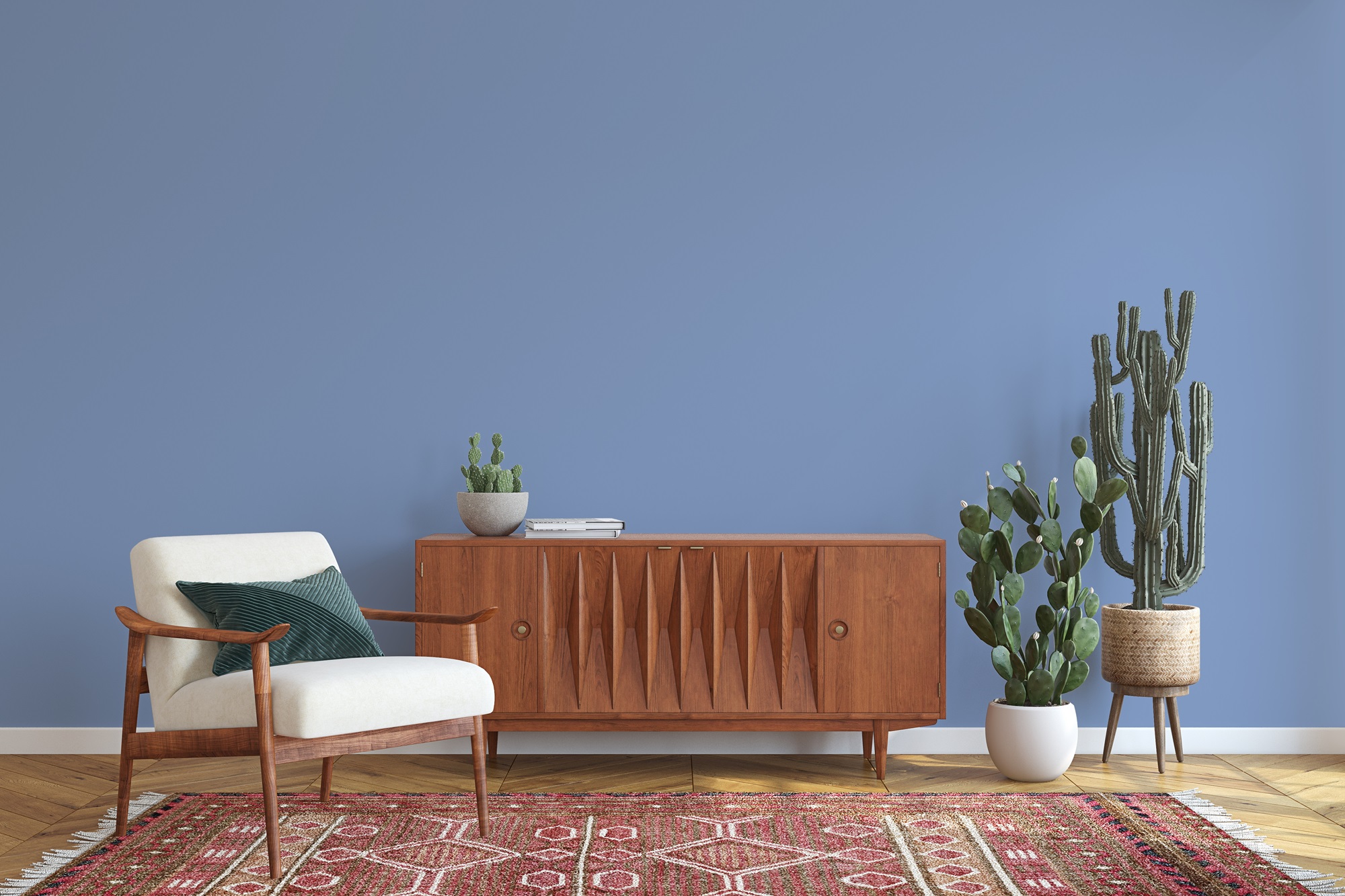 A living room interior with a mid-century modern credenza, a cactus plant and a white armchair