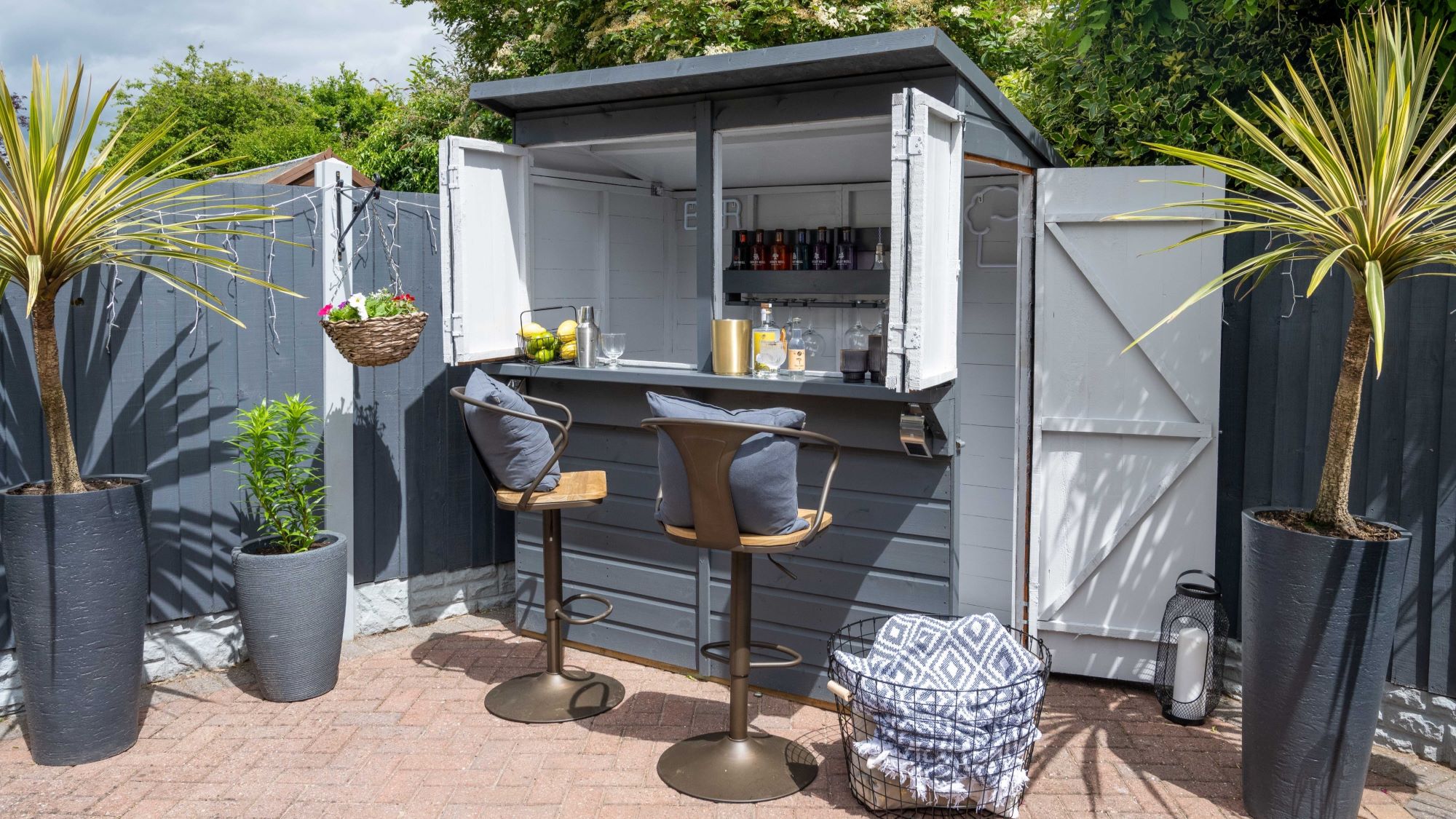 Image of a colourful outdoor bar which has been painted in a classic grey shade