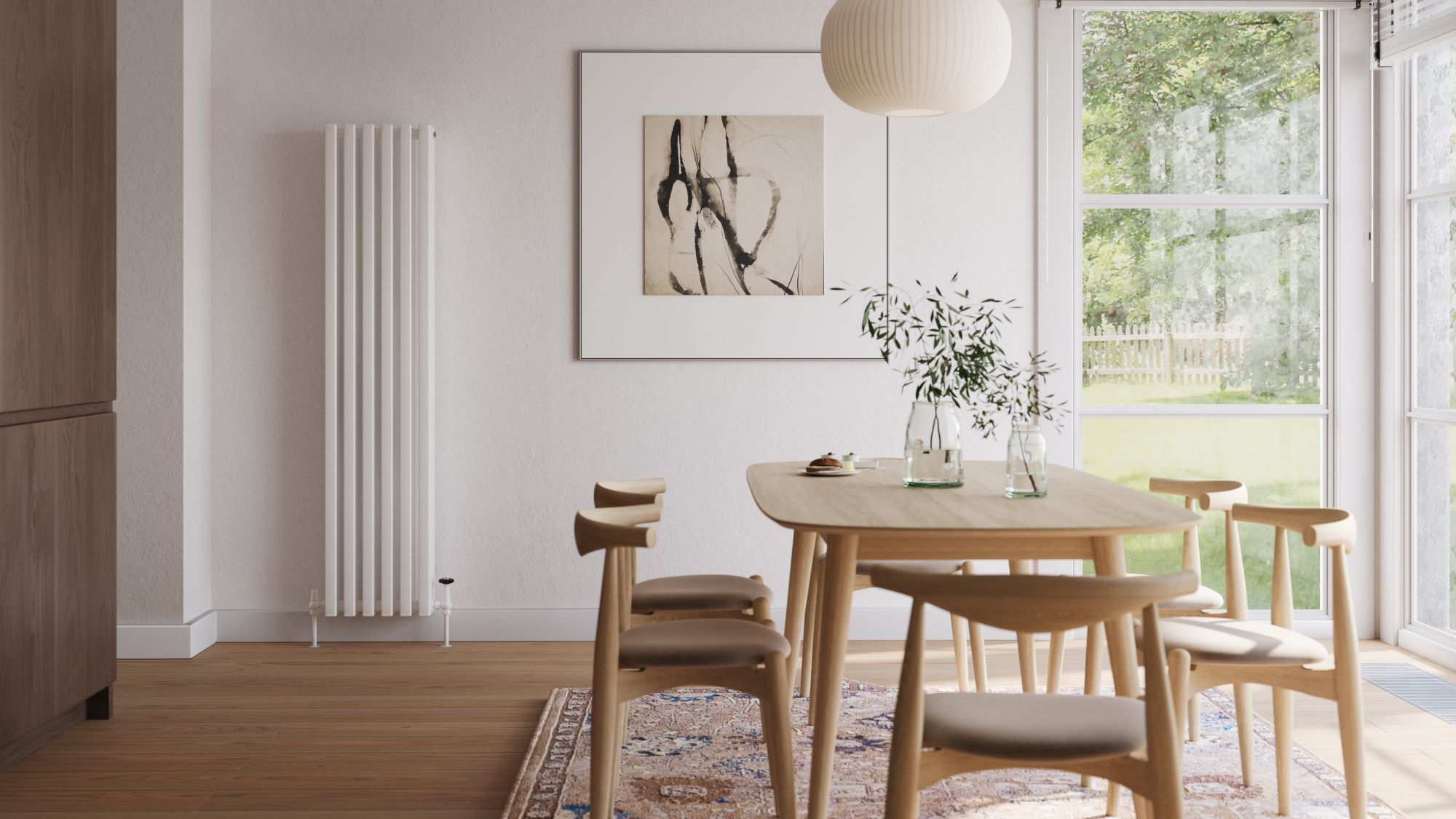 A tall, white vertical radiator stands out against the white wall, adding a modern touch.