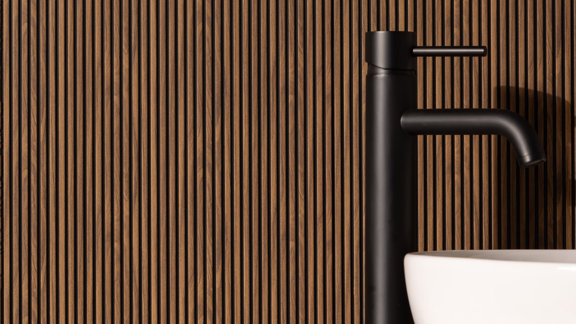 Microslat wall panels adds visual interest and warmth to the space.