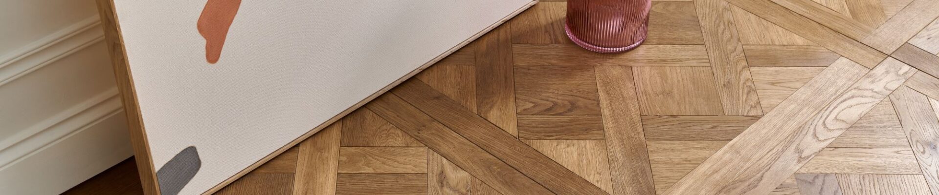 Beautiful wood panelling in an ornate pattern. The wood appears to be a light oak colour with a natural finish.