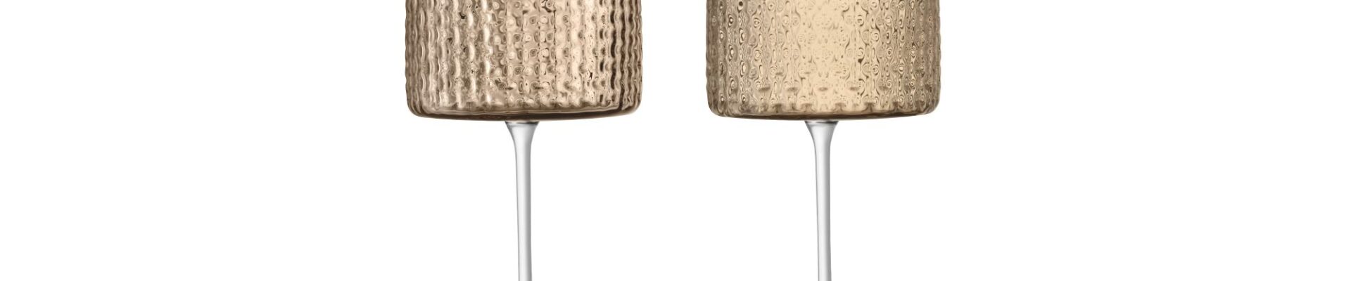These are tall, clear glasses with a textured, wicker-like pattern on the bowl. The bowls are a light amber colour and the stems are clear.