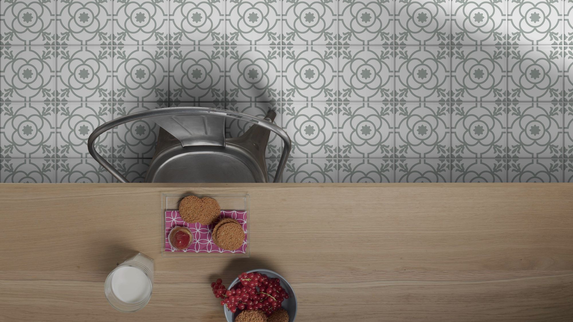 The floor is covered in a white and grey patterned tile. The pattern consists of repeating four-leaf clover shapes with a circular design in the centre. The pattern creates a sense of symmetry and elegance.