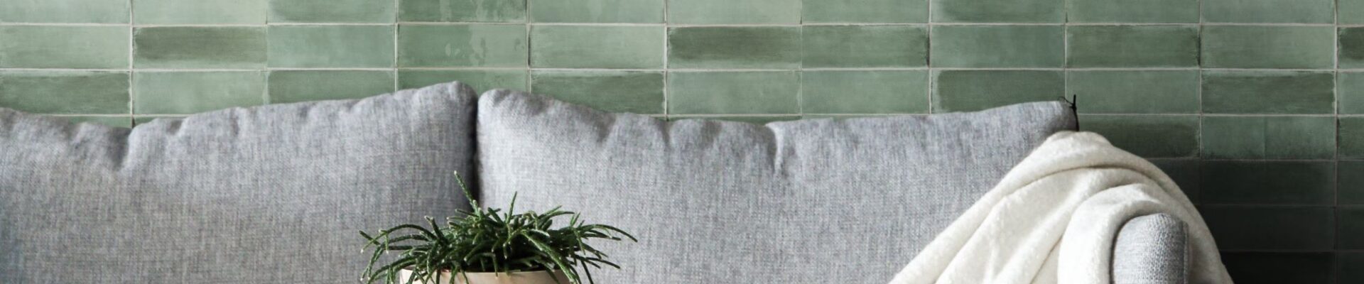 A beautiful green tile backsplash creates a calming and inviting atmosphere in this living room