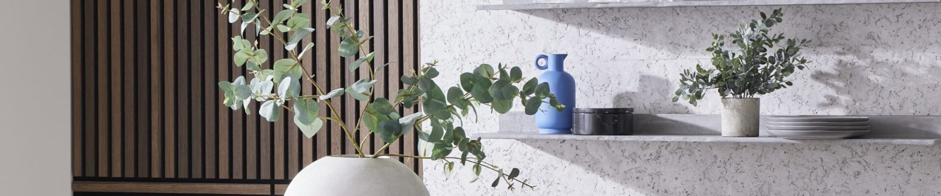The image showcases a modern and stylish interior design with a focus on texture and natural elements. It evokes a sense of calm and sophistication with its use of neutral colours and organic materials.