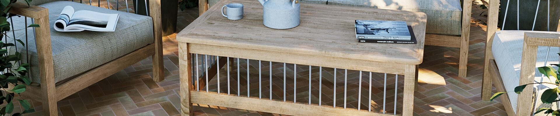 The patio features herringbone-patterned terracotta tiles in warm, earthy tones, creating a visually appealing surface.