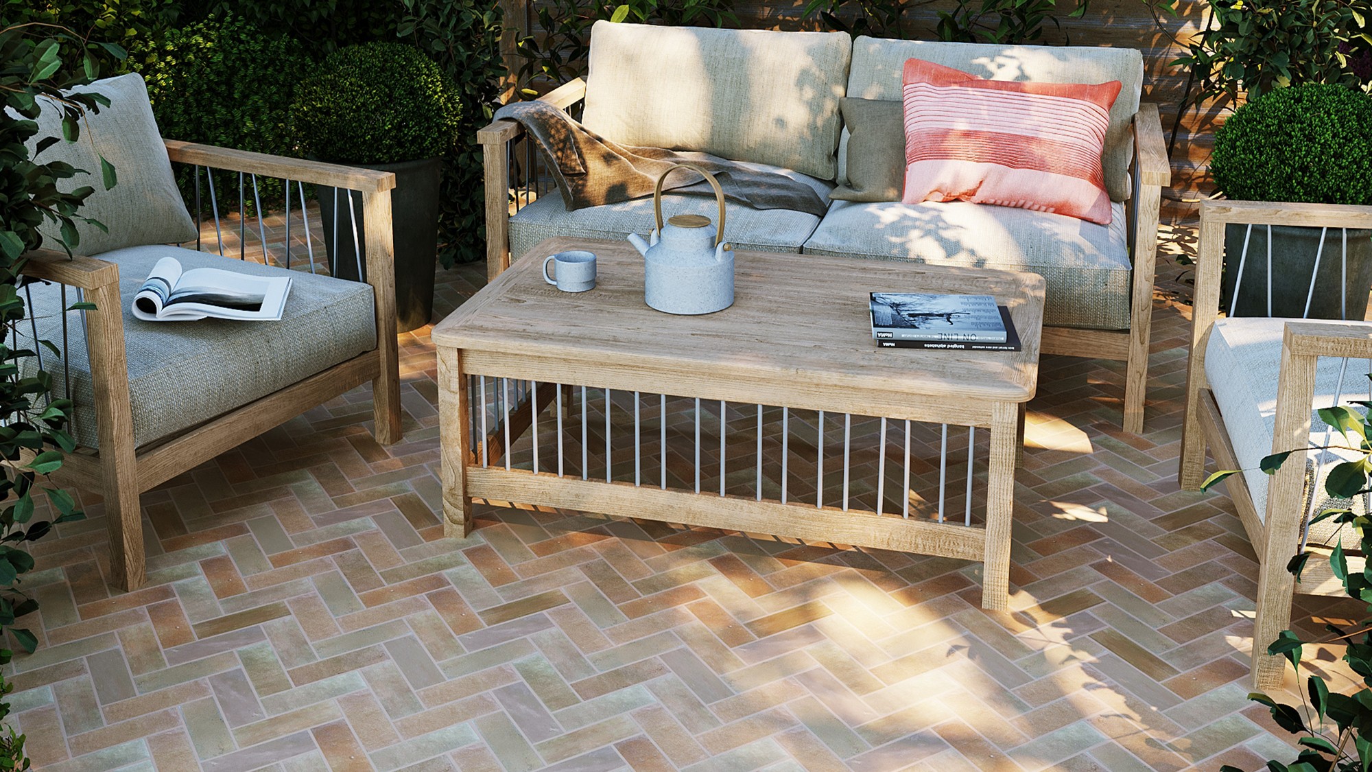 The patio features herringbone-patterned terracotta tiles in warm, earthy tones, creating a visually appealing surface.