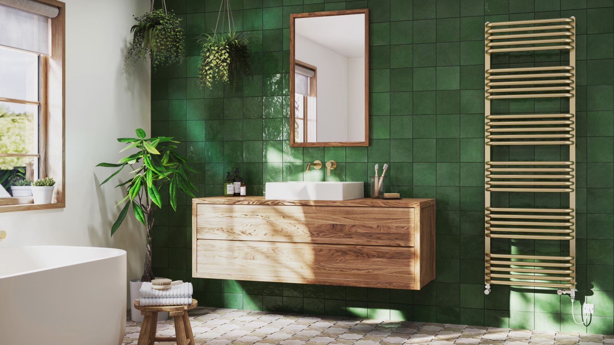 A modern bathroom with green tiles, a brass towel rail and wooden vanity.