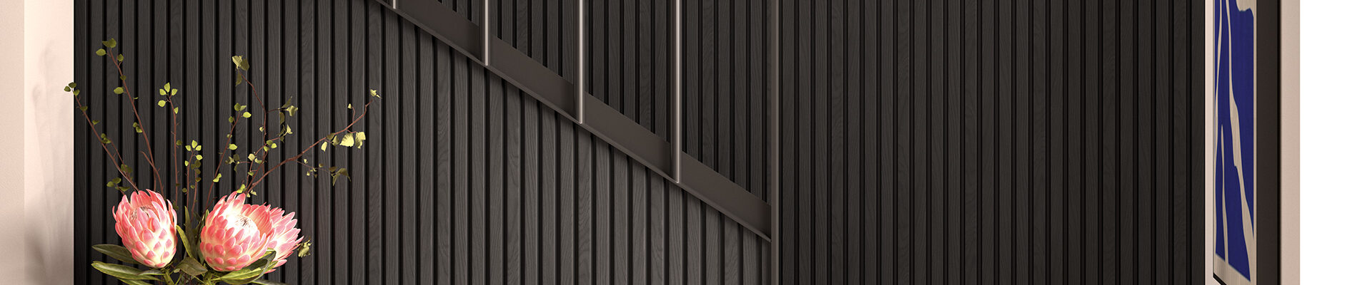 A modern interior space featuring a dark, slatted wall treatment that extends up a staircase.