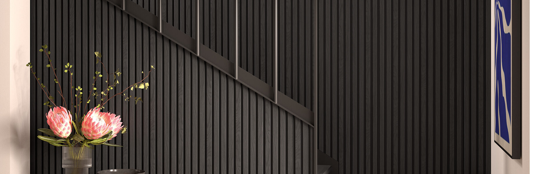 A modern interior space featuring a dark, slatted wall treatment that extends up a staircase.