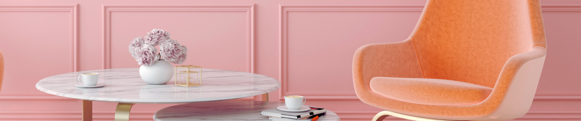 A pink panelled wall adds a touch of elegance, and the light wood flooring keeps everything feeling airy.